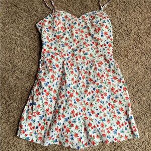 White Floral romper with Red and Blue Blossoms